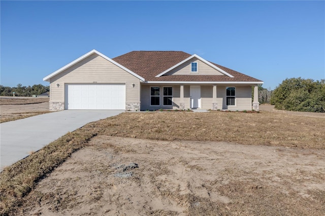 view of front of home with a garage and a front yard