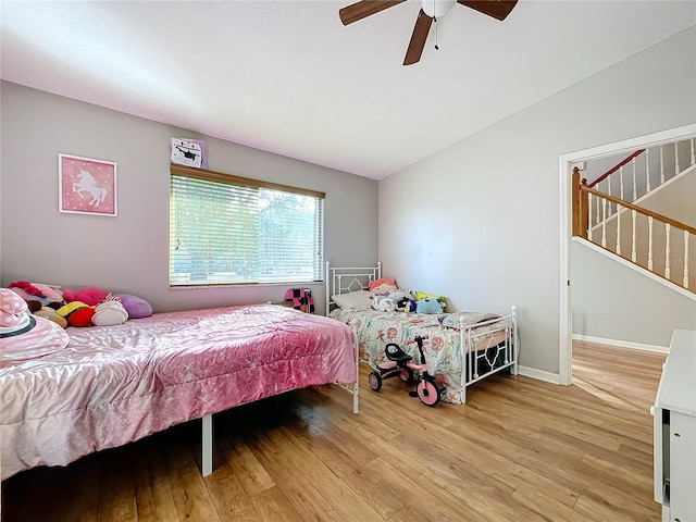 bedroom with ceiling fan and light hardwood / wood-style flooring