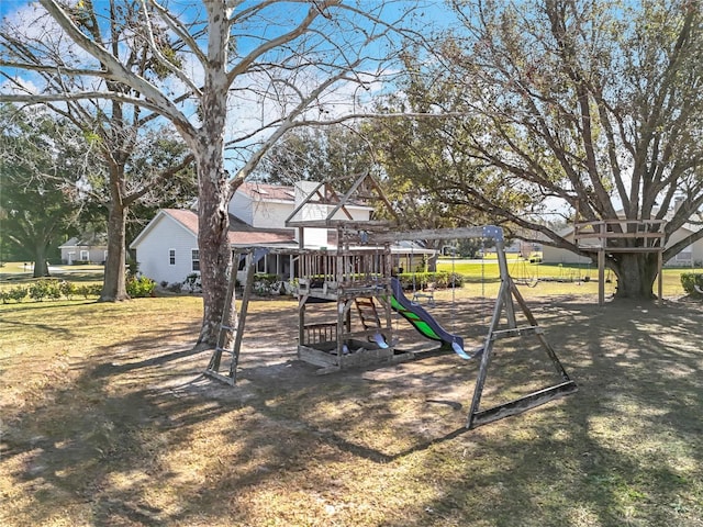 view of playground with a lawn