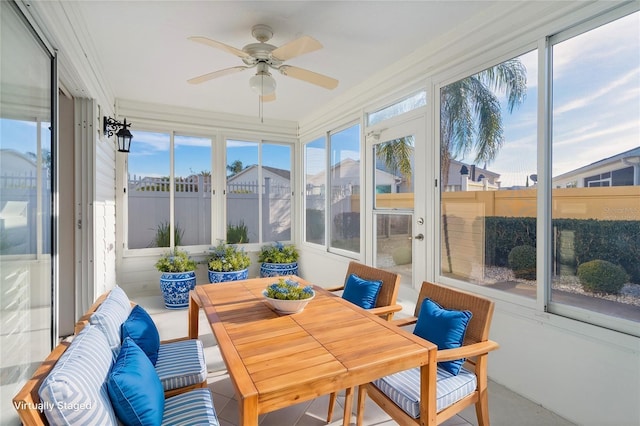 sunroom / solarium with a wealth of natural light and ceiling fan