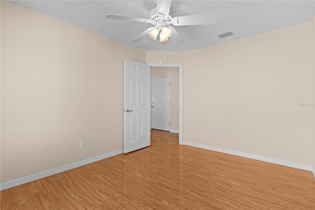 spare room featuring ceiling fan and light hardwood / wood-style floors