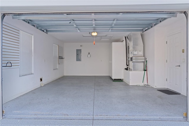 garage with a garage door opener, heating unit, and electric panel