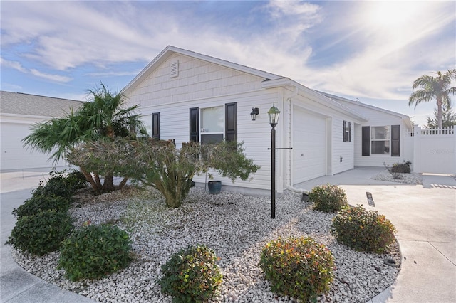 view of side of home with a garage