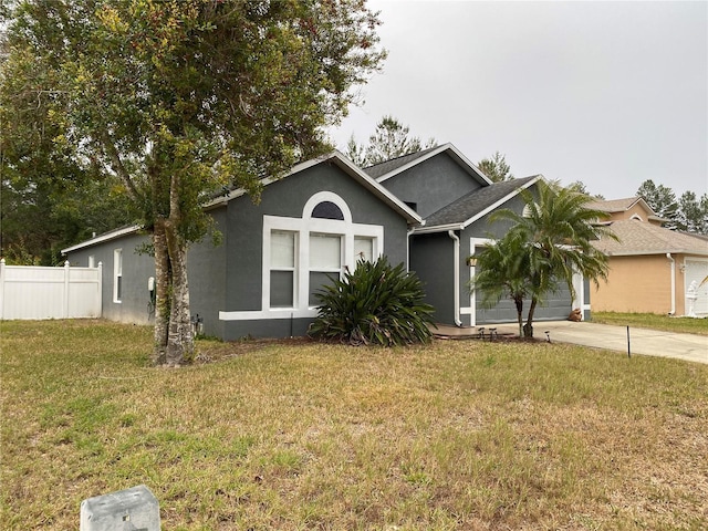 view of front of home with a garage and a front yard