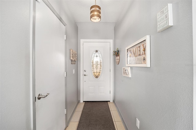 doorway with light tile patterned floors