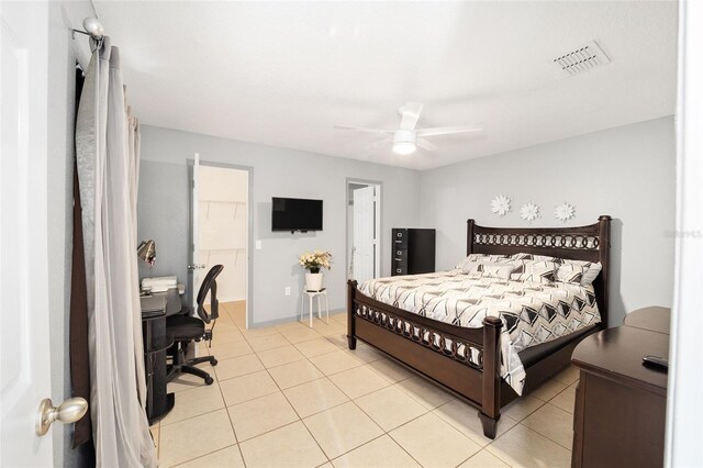 tiled bedroom with ceiling fan