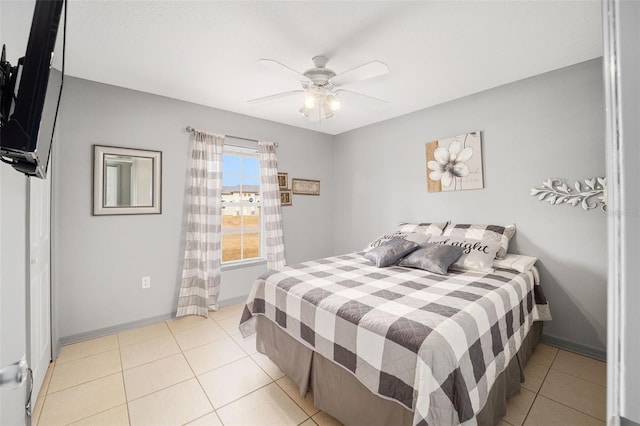 bedroom with light tile patterned floors and ceiling fan