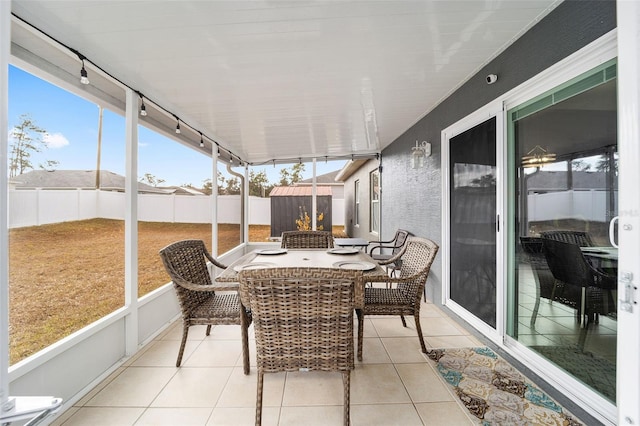 sunroom / solarium with rail lighting