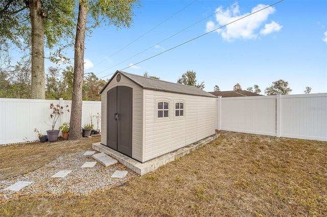 view of outbuilding with a lawn