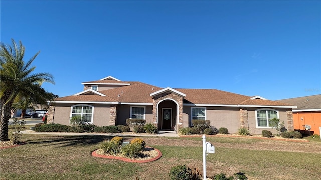 ranch-style house with a front lawn