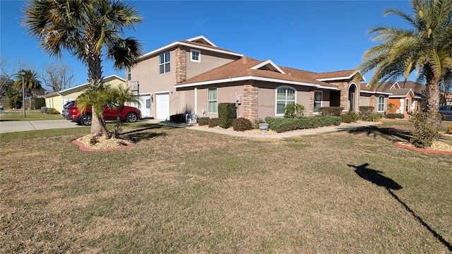 view of front of property with a garage and a front yard