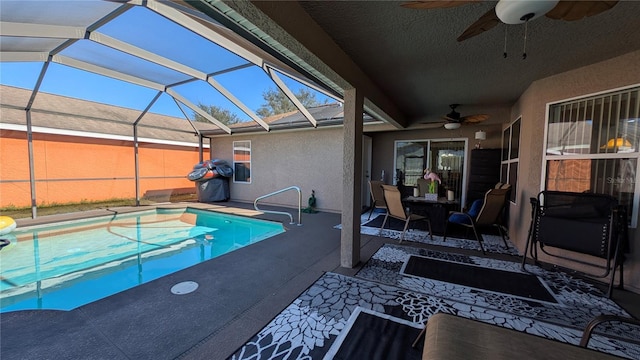 view of pool featuring a patio, a lanai, and ceiling fan