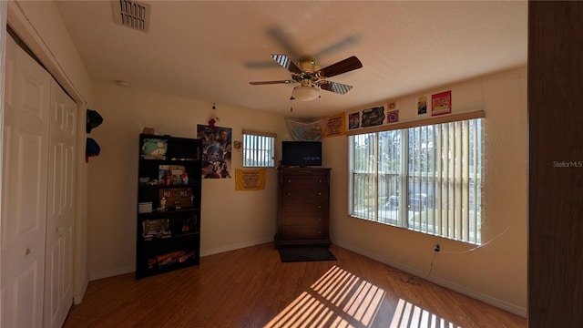 unfurnished room featuring ceiling fan and hardwood / wood-style floors