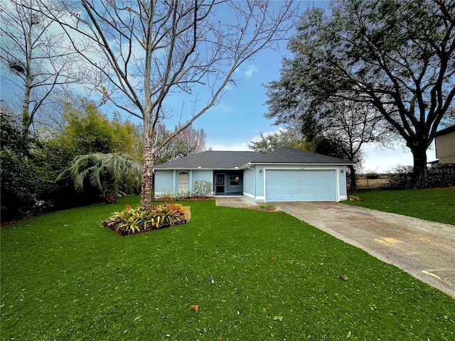 view of front of home featuring a garage and a front yard