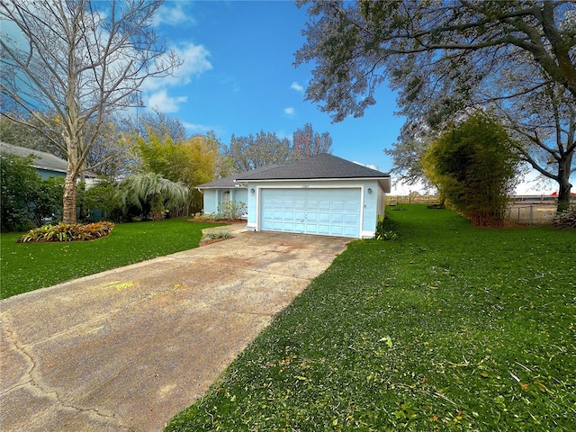 exterior space with a garage and a lawn