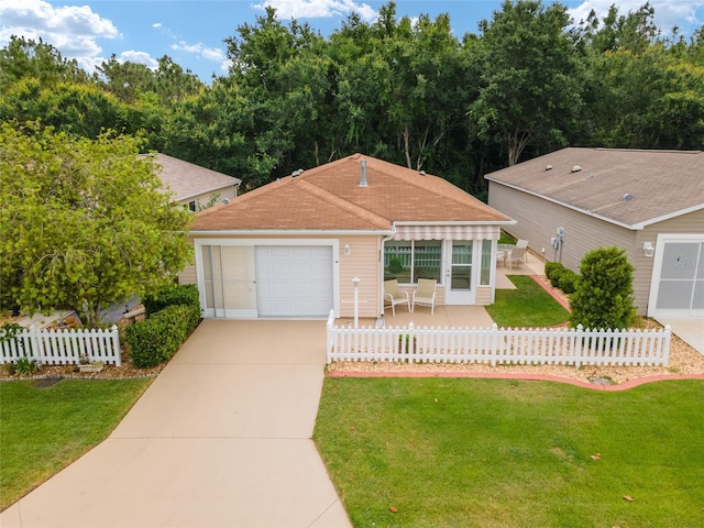 single story home with a garage and a front lawn