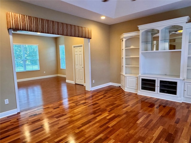 unfurnished living room with hardwood / wood-style flooring