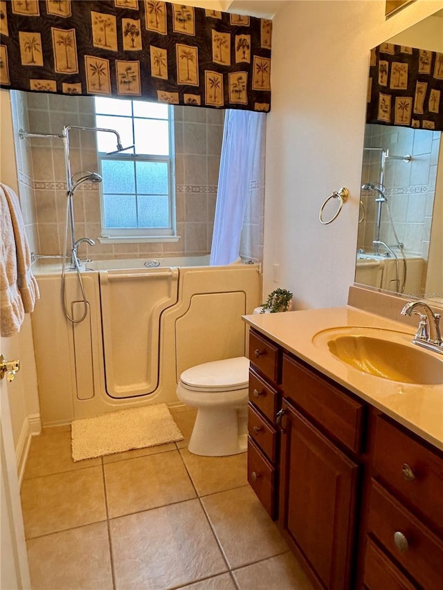 bathroom featuring tile patterned flooring, vanity, and toilet