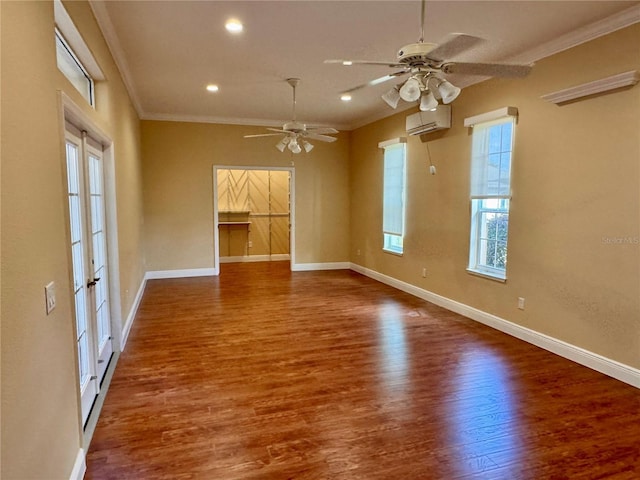 unfurnished room with ceiling fan, ornamental molding, a wall mounted AC, and wood-type flooring