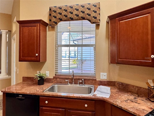 kitchen featuring ornate columns, black dishwasher, and sink