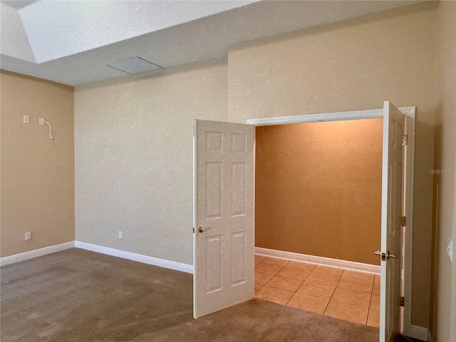 spare room featuring tile patterned flooring