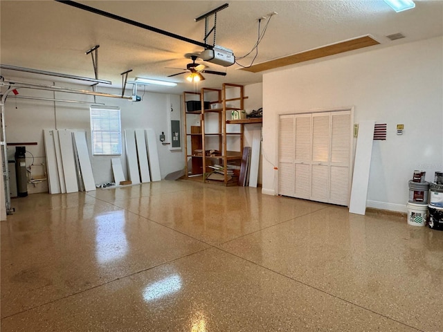 garage featuring a garage door opener and electric panel