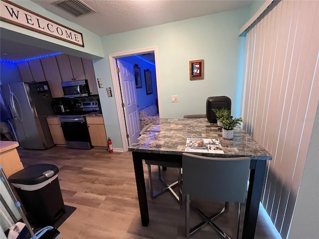 dining room with light hardwood / wood-style flooring