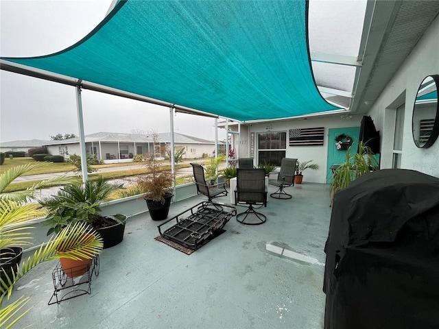 view of patio / terrace featuring area for grilling and an AC wall unit