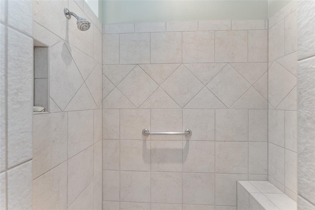 bathroom featuring a tile shower