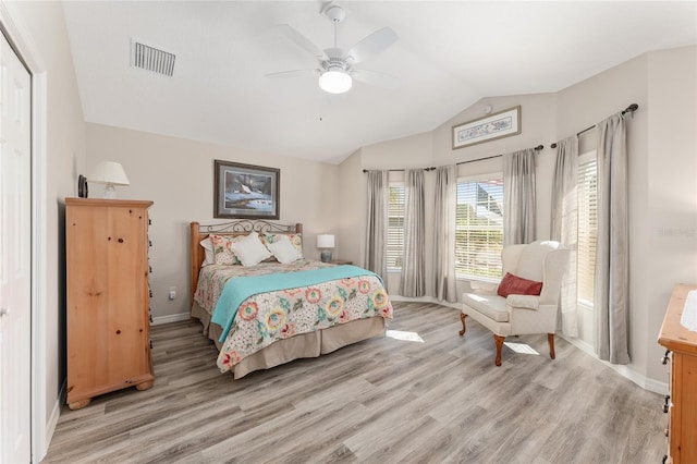 bedroom featuring lofted ceiling, ceiling fan, and light hardwood / wood-style floors