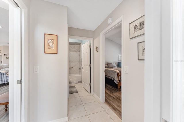 hall with light tile patterned flooring