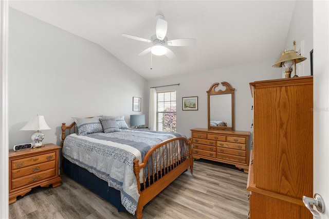 bedroom with wood-type flooring, lofted ceiling, and ceiling fan