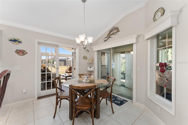 dining area with vaulted ceiling, light tile patterned flooring, plenty of natural light, and a chandelier