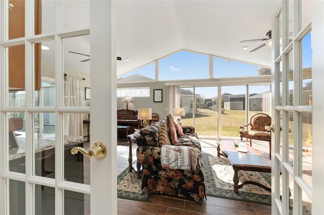 living room with vaulted ceiling, french doors, and ceiling fan