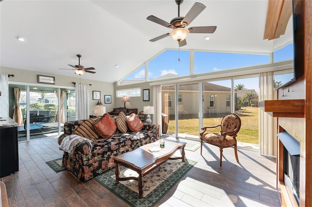 living room with vaulted ceiling and ceiling fan