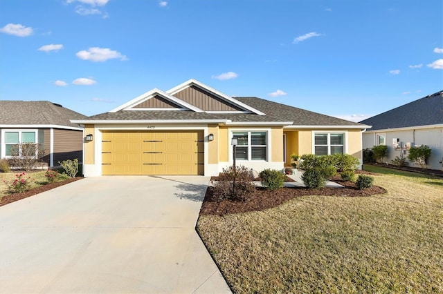 single story home with a garage and a front yard