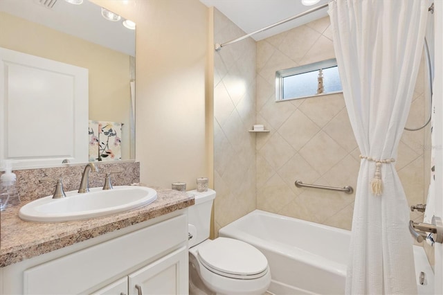 full bathroom featuring vanity, shower / bathtub combination with curtain, and toilet