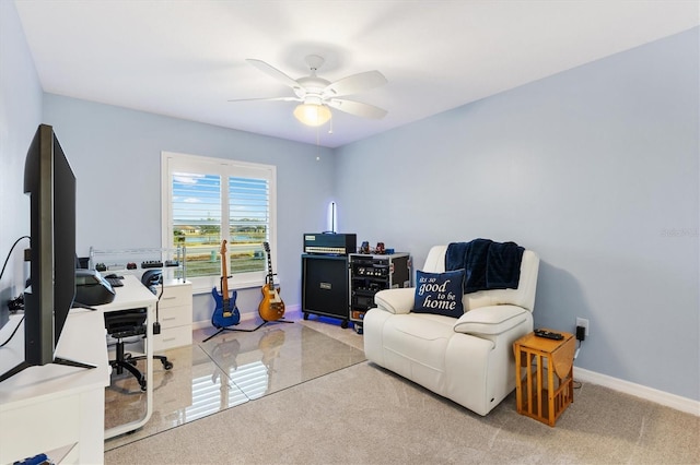 carpeted home office with ceiling fan