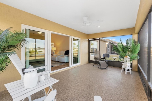 sunroom / solarium with ceiling fan