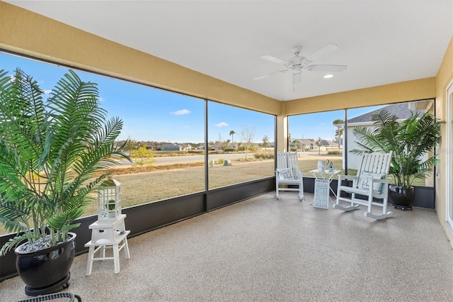 sunroom / solarium with ceiling fan and plenty of natural light