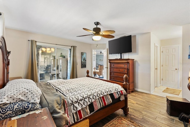 bedroom with ceiling fan, access to exterior, and light hardwood / wood-style flooring