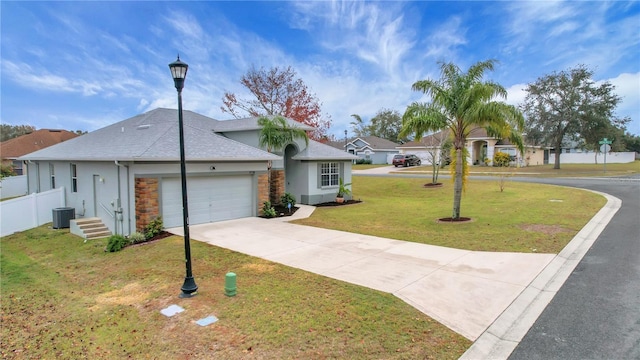 ranch-style home featuring central AC unit, a garage, and a front lawn