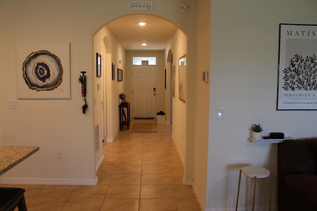 hallway with light tile patterned floors