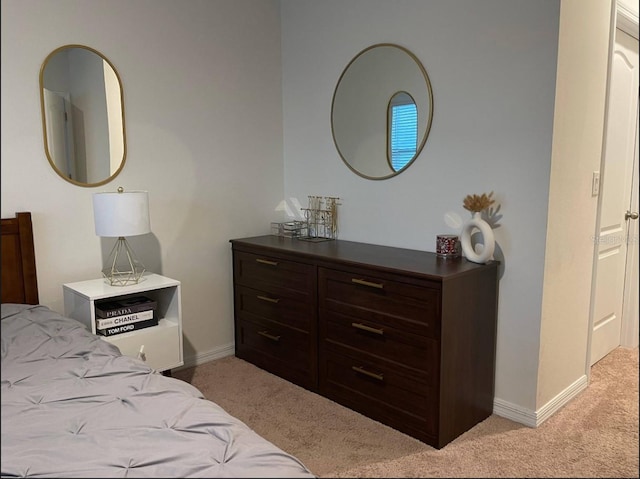 bedroom with light colored carpet