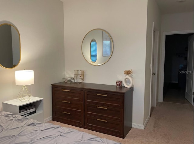 bedroom featuring light colored carpet