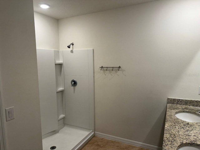 bathroom featuring vanity and a shower