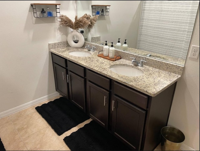 bathroom with vanity and tile patterned floors