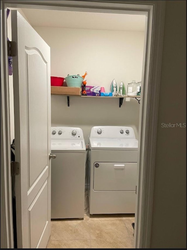 clothes washing area with washer and dryer