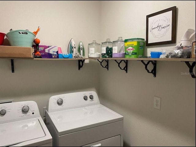 laundry area with washing machine and dryer