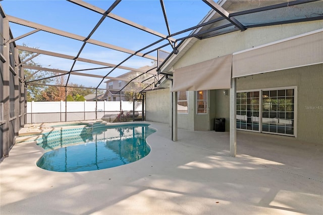 view of pool featuring a patio and glass enclosure